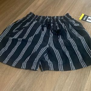 Black and white shorts.